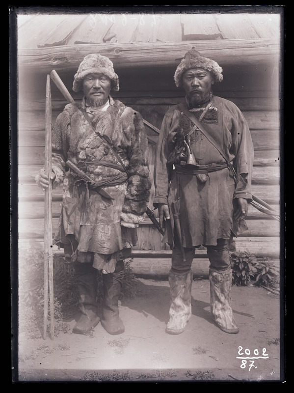 A Tungus man, Seleznev (on the left) and <...> in winter hunting clothes (facing). 2002-092 - profileofile; Povarinskii ulus